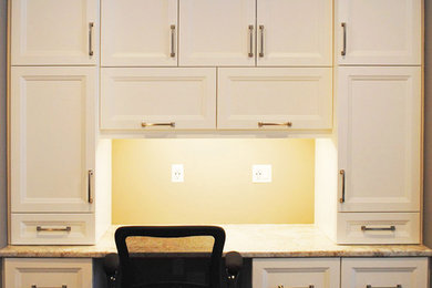 Inspiration for a mid-sized transitional built-in desk ceramic tile home office remodel in Toronto with beige walls