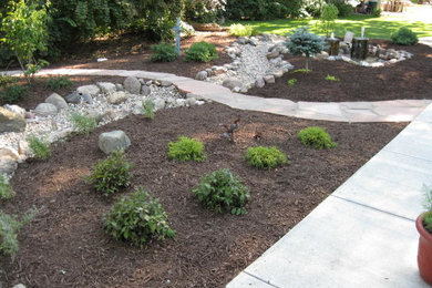 Dry creek bed and raingarden after