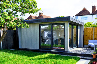 Design ideas for a medium sized contemporary garden shed and building in Surrey.