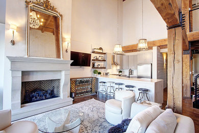 デンバーにある高級な中くらいなインダストリアルスタイルのおしゃれなリビングロフト (白い壁、無垢フローリング、標準型暖炉、石材の暖炉まわり、壁掛け型テレビ) の写真