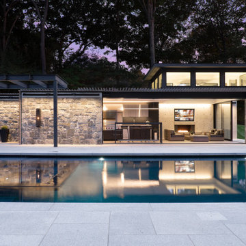 Waterfront Stone Modern Home and Pool House