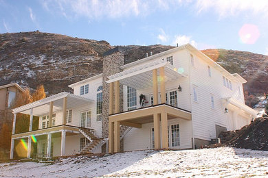 Example of an arts and crafts white wood exterior home design in Salt Lake City