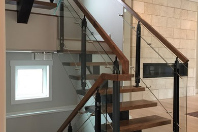 Example of a mid-sized trendy wooden u-shaped open staircase design in Edmonton