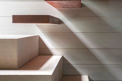Example of a trendy wooden floating open staircase design in Austin