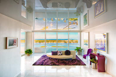 Inspiration for a large contemporary formal and open concept porcelain tile and beige floor living room remodel in Miami with beige walls, no fireplace and no tv