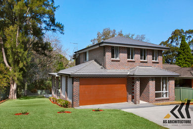 This is an example of a mid-sized traditional two-storey brick brown house exterior in Sydney with a tile roof.