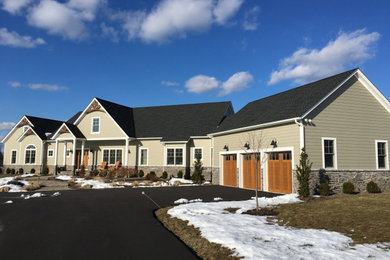 Example of a country exterior home design in New York