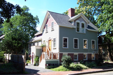 Traditional green exterior home idea in Boston with a shingle roof