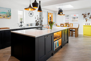 Design ideas for a contemporary kitchen/diner in Dorset with an island.