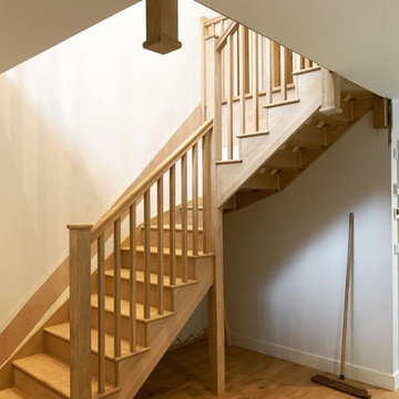 Oak cut-string staircase with square oak spindles