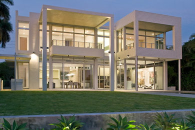 Inspiration for a contemporary white two-story exterior home remodel in Miami