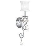 Livex Lighting - Newcastle Wall Sconce, Brushed Nickel - Add glamour to your home with this enchanting wall sconce. A scrolling arm adorned in a brushed nickel finish is paired with glittering crystal drops that reflect light when illuminated. A white handmade silk shimmer shade completes this chic design.