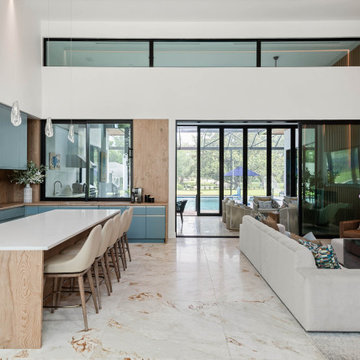 Lake ButlerThis striking kitchen pairs matte blue cabinetry with warm, natural w