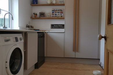 This is an example of a contemporary utility room in Surrey.