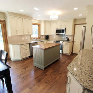 Cream Kitchen with Green Island with Butcher Block Countertop