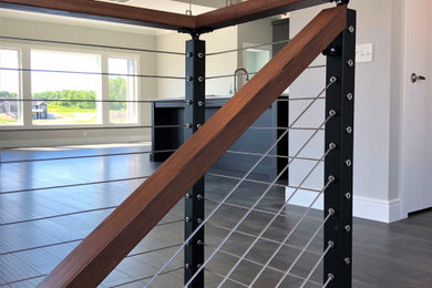 Staircase - contemporary wooden straight open and cable railing staircase idea in Other