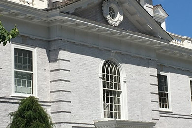 Huge traditional white house exterior idea in New York