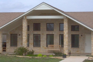 Mid-sized traditional brown one-story stone exterior home idea in Oklahoma City with a shingle roof