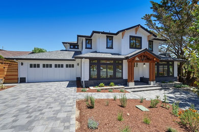 Inspiration for a large craftsman white two-story wood house exterior remodel in San Francisco with a hip roof and a shingle roof