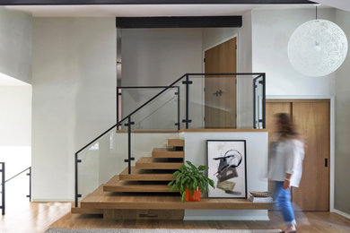 Inspiration for a mid-century modern staircase remodel in Milwaukee