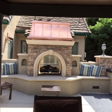 Custom Copper Temptress Atop An Outdoor Fireplace