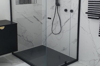 Large contemporary master bathroom in Melbourne with dark wood cabinets, a corner shower, black and white tile, porcelain tile, white walls, marble floors, an open shower, a niche and a floating vanity.