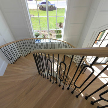 Project #95 | Freestanding Elliptical Staircase with Geometric Iron Balusters