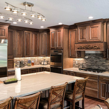 Full Kitchen Remodel with Stained Finish and Ornate Stove Hood