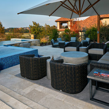 Poolside Seating Area with Barrel Chairs and Large Umbrella