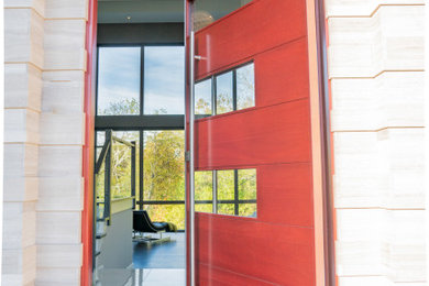 Design ideas for an expansive contemporary front door in Cincinnati with a pivot front door and a red front door.
