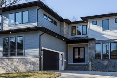 Inspiration for a large modern blue two-story concrete fiberboard exterior home remodel in DC Metro