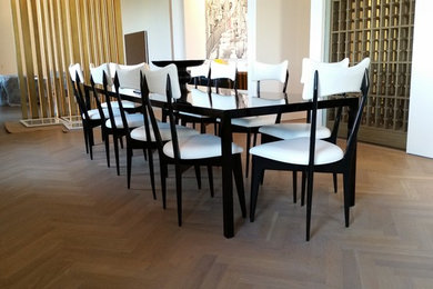 Inspiration for a classic dining room in New York with white walls and light hardwood flooring.