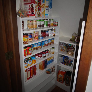 Under the stairs pantry!  Wasted space?  Think again!