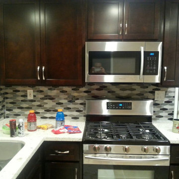 kitchen Espresso shaker cabinets with Modern Quartz countertops