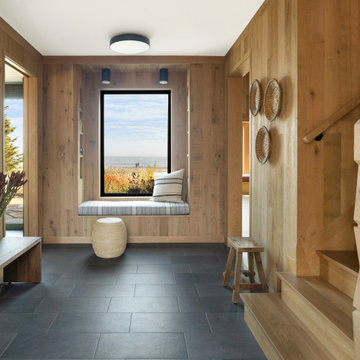 White Oak Paneling and Stair Post in Scandinavian Mudroom