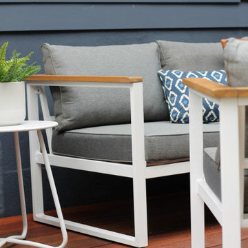 Navy Blue Exterior Siding with Modern Deck and Nautical Furniture
