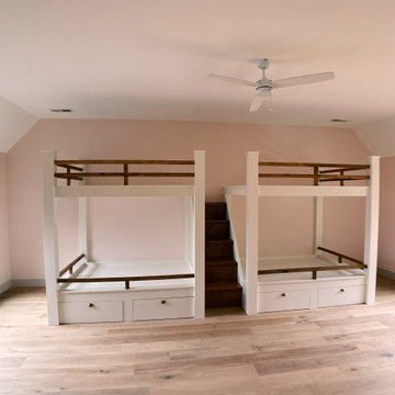 Spacious Shared Kids Room with Custom Bunk Beds, Integrated Drawers, and Vaulted
