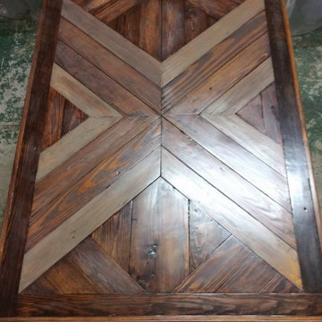 Dining table built with reclaimed heart pine flooring