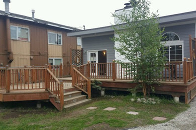 Inspiration for a mid-sized timeless backyard patio remodel in Other with decking and no cover