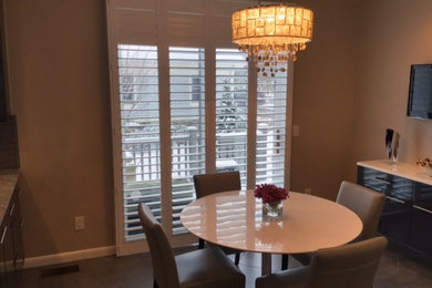 Example of a mid-sized country kitchen/dining room combo design in New York with beige walls and no fireplace