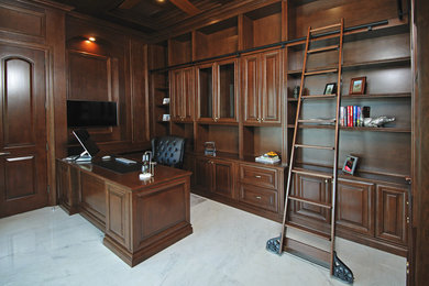 Design ideas for a large traditional home office in Miami with brown walls, marble floors, a built-in desk and white floor.