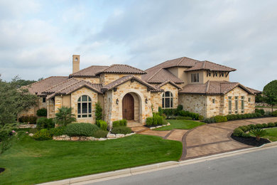 Example of a tuscan home design design in Austin
