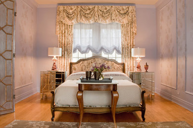 Inspiration for a timeless master medium tone wood floor, brown floor and wall paneling bedroom remodel in Chicago with purple walls and no fireplace