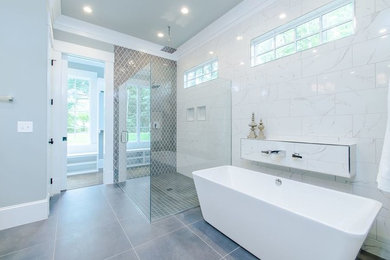 Design ideas for a large transitional master bathroom in Raleigh with raised-panel cabinets, white cabinets, a freestanding tub, an open shower, a one-piece toilet, gray tile, white tile, ceramic tile, white walls, ceramic floors, a drop-in sink, marble benchtops, grey floor and an open shower.