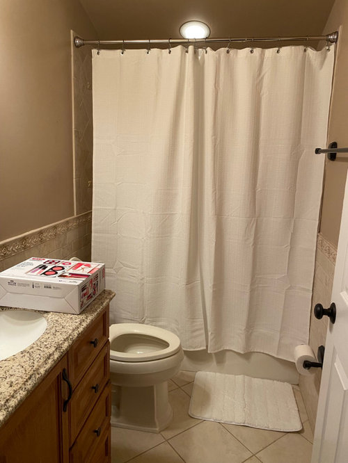 ideas to spruce up bathroom on a budget?