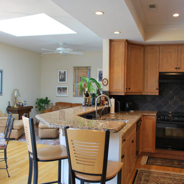 Stained cabinets open to Keeping Room