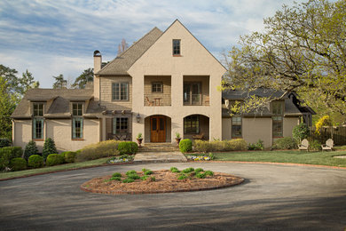 Large transitional beige gable roof idea in Birmingham