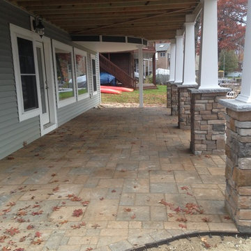 Lakeside patio with stone column bases