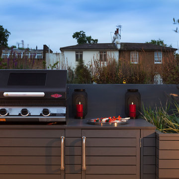 The built in BBQ nestled amongst the raised beds