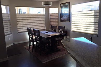 Great room - mid-sized traditional dark wood floor great room idea in Denver with beige walls and no fireplace